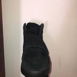 All black Adidas tubular strappy shoes